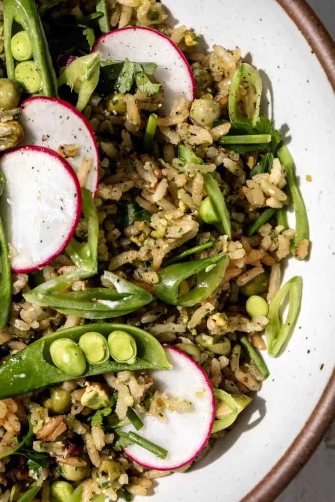Close up Rice Pilaf with Pistachio Pesto on a plate.