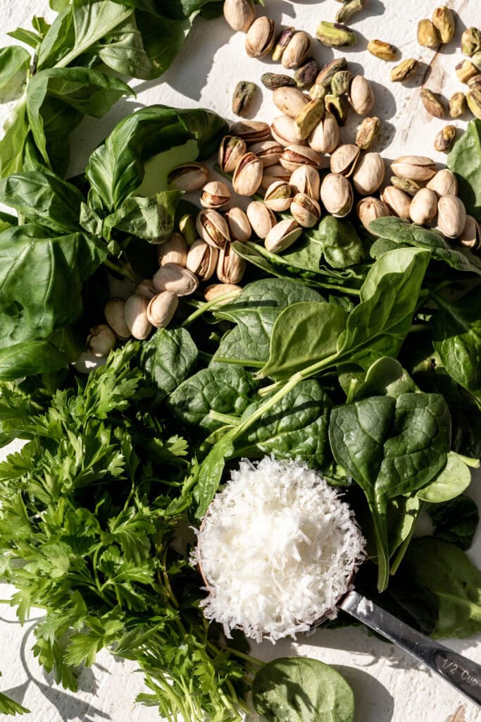 Fresh pistachio pesto ingredients ready to be mixed. 