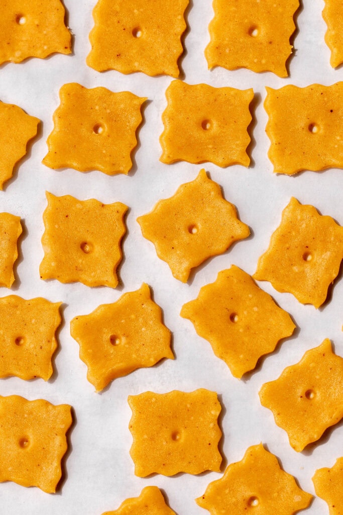 separated dough Homemade Cheez It Crackers with fluted edges.