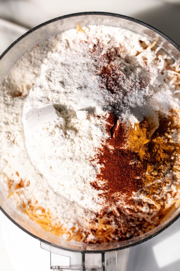 ingredients to make cheez-it crackers in food processor.