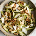 shaved asparagus salad with marcona almonds, shaved ricotta salata and breadcrumbs.