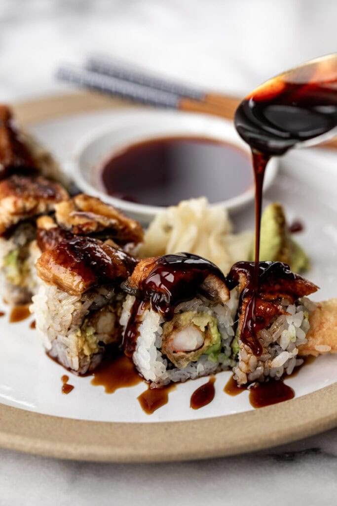 homemade eel sauce drizzled over shrimp tempura and eel roll.