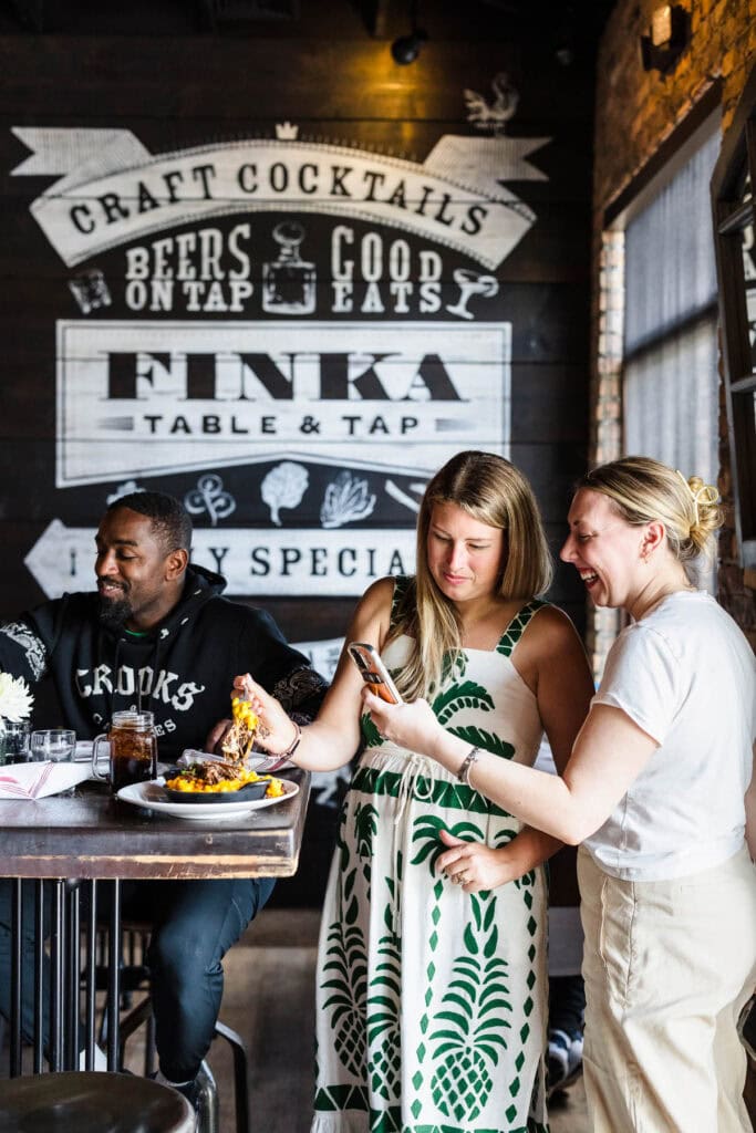 miami food bloggers photographing dishes behind the scenes