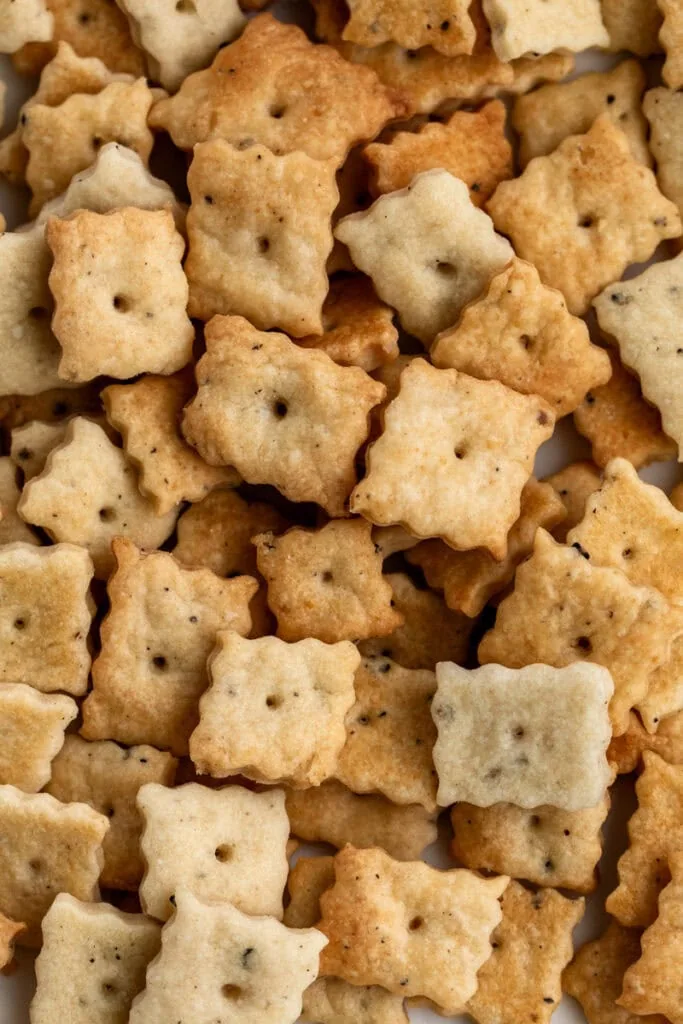 parmesan and pecorino romano cheez it crackers with black pepper.