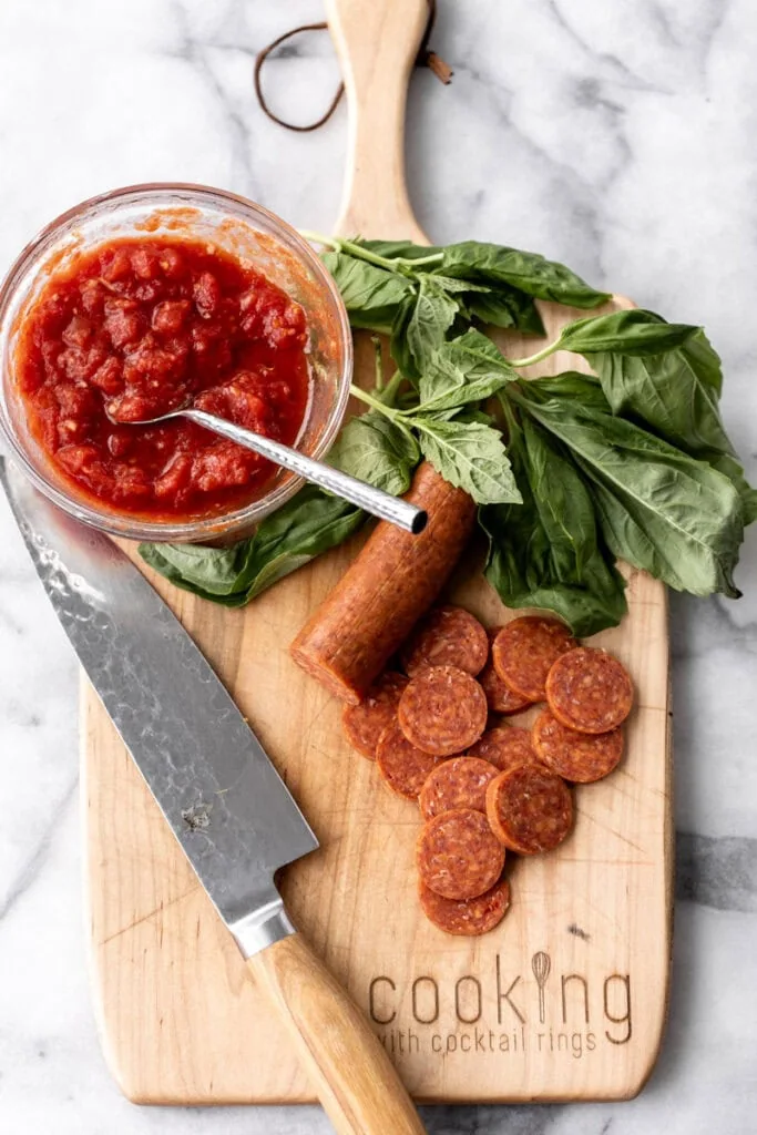 pizza sauce fresh basil and sliced pepperoni