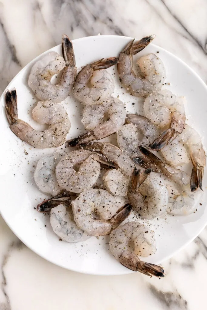 peeled and deveined shrimp with salt and pepper.
