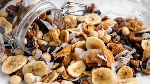 tropical trail mix with dried banana slices and coconut shavings.