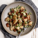 cauliflower gnocchi with bacon and easy Alfredo sauce and peas.