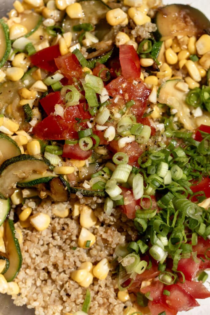 cooked quinoa and sautéed zucchini and corn salad.