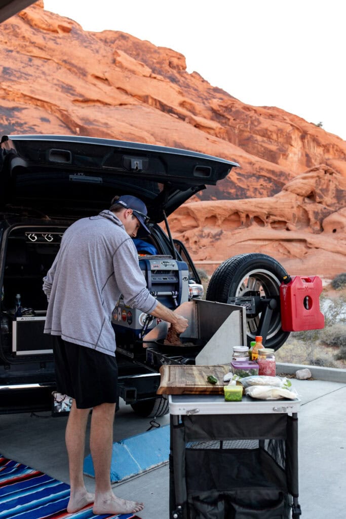 cooking tacos in back of car.