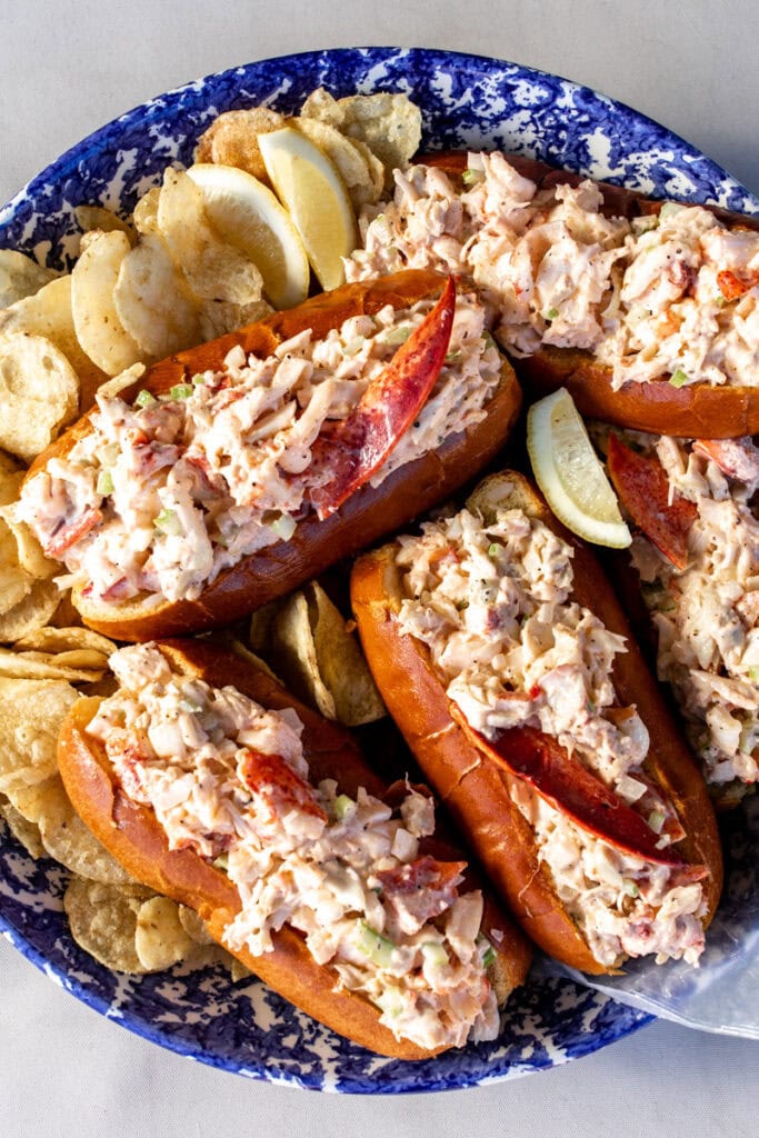 New England-Style Lobster Rolls on blue and white platter.