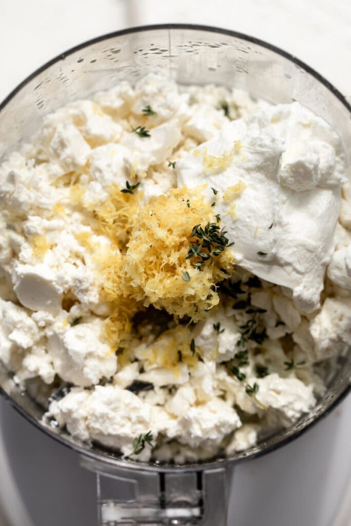 ingredients of Whipped Feta Dip in a food processor.