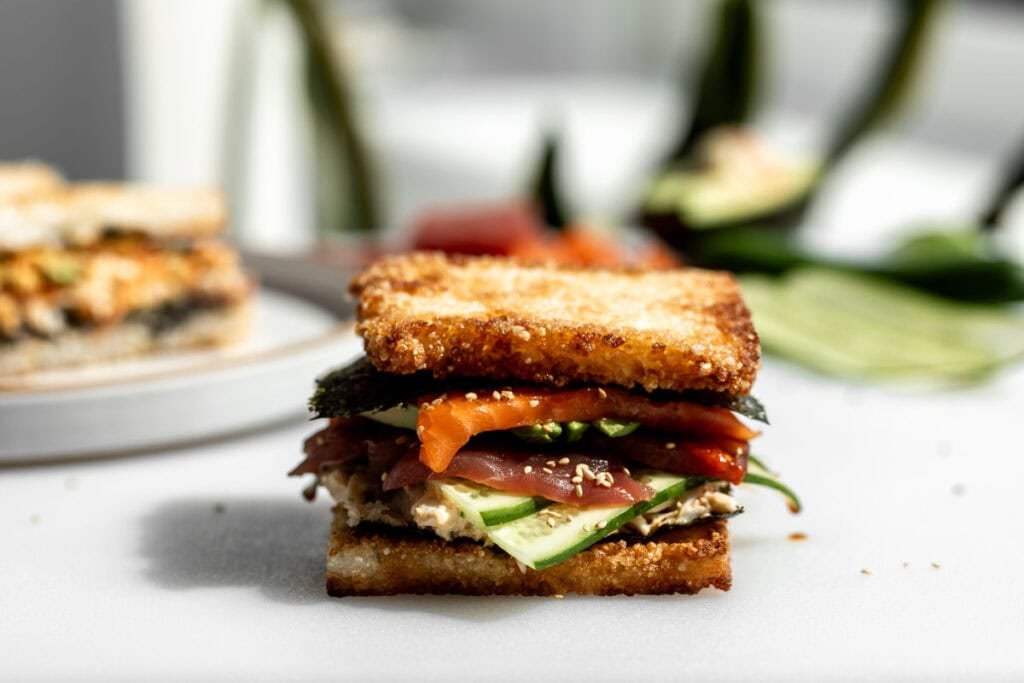 erewhon copycat crispy rice sushi sandwich with layered cucumber, tuna, salmon and crab.