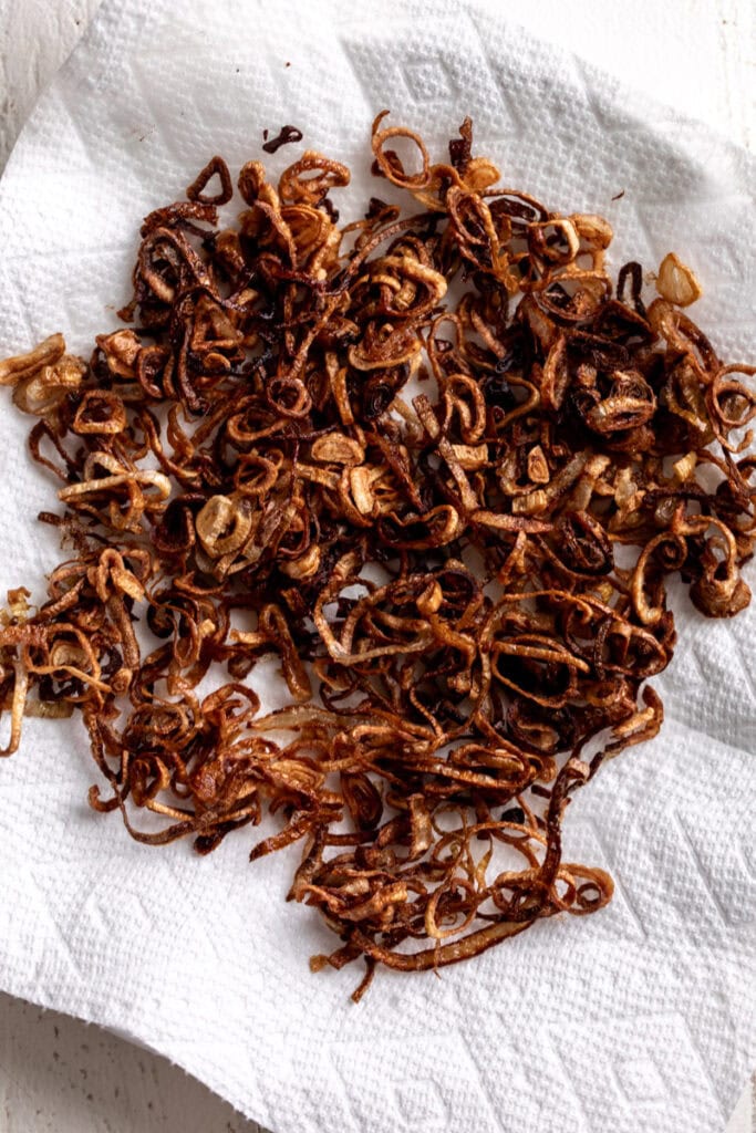 golden brown fried shallots on paper towels.