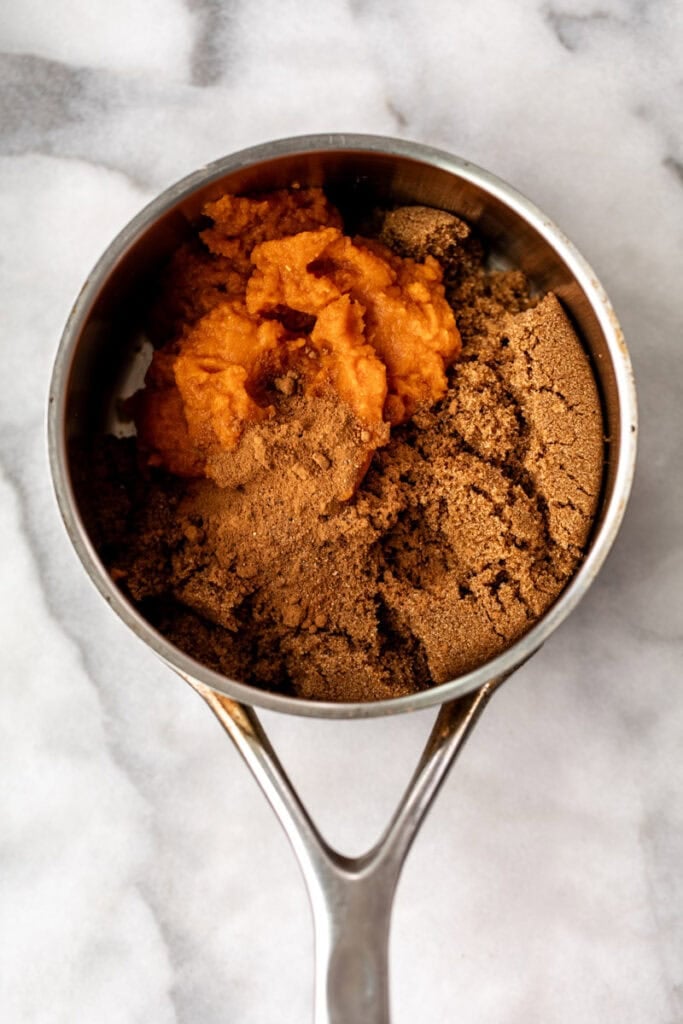 ingredients pumpkin puree and spice syrup in small pot.