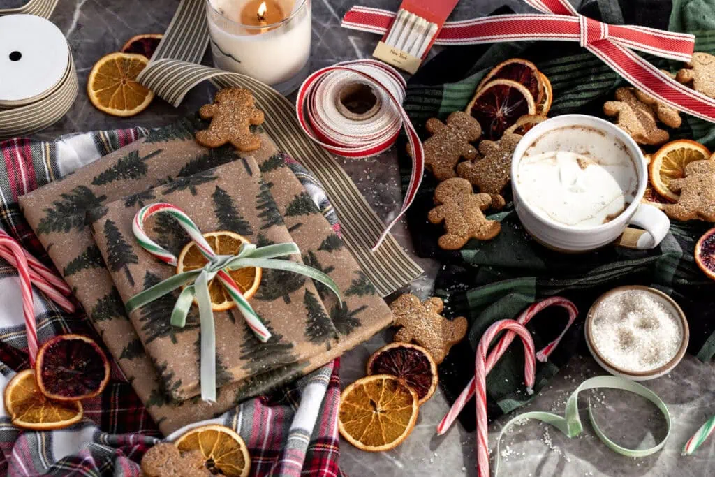 Cwcr annual gift guide header image gift wrapping with candy canes and hot chocolate.