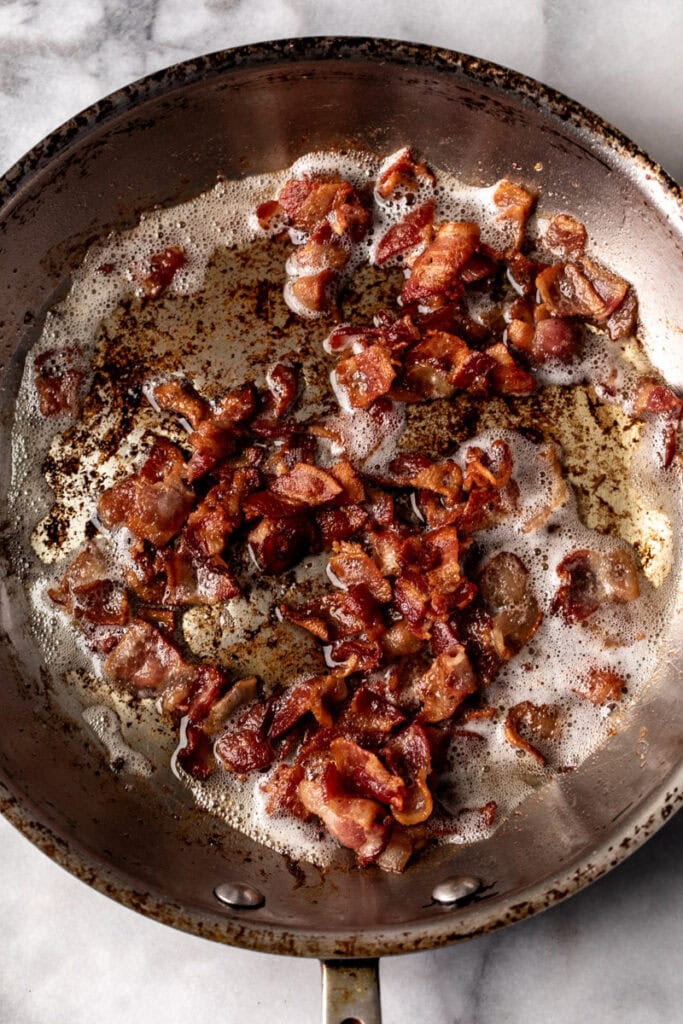 cooked bacon in pan.
