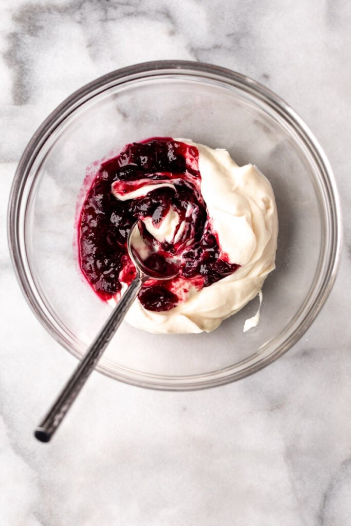 cranberry mayo in glass mixing bowl.