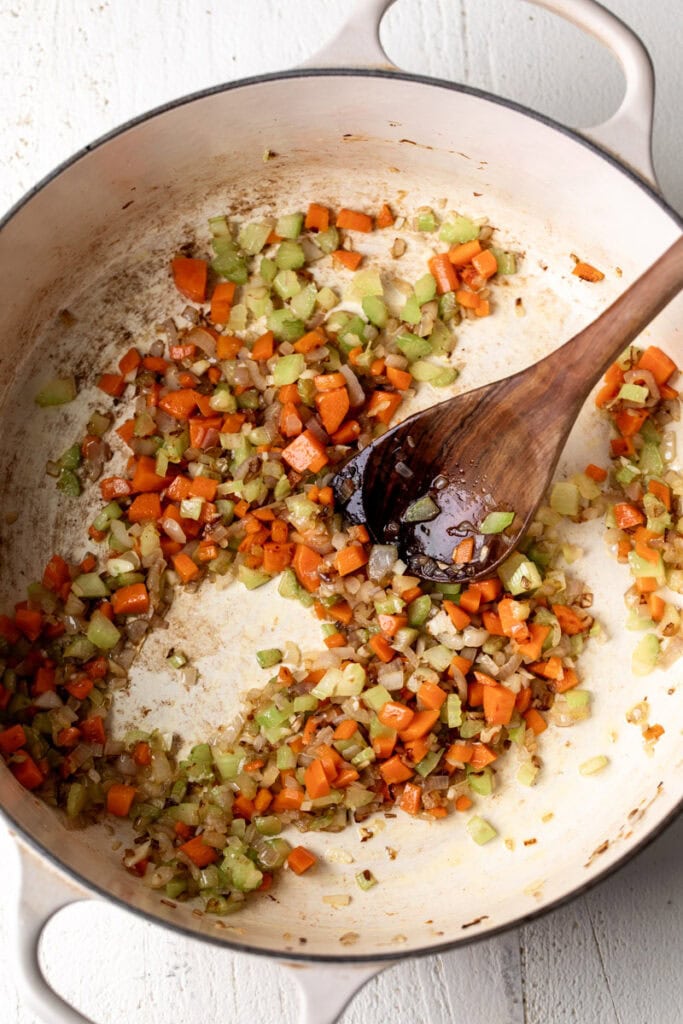 sautéed mirepoix in pot carrots onion and celery.