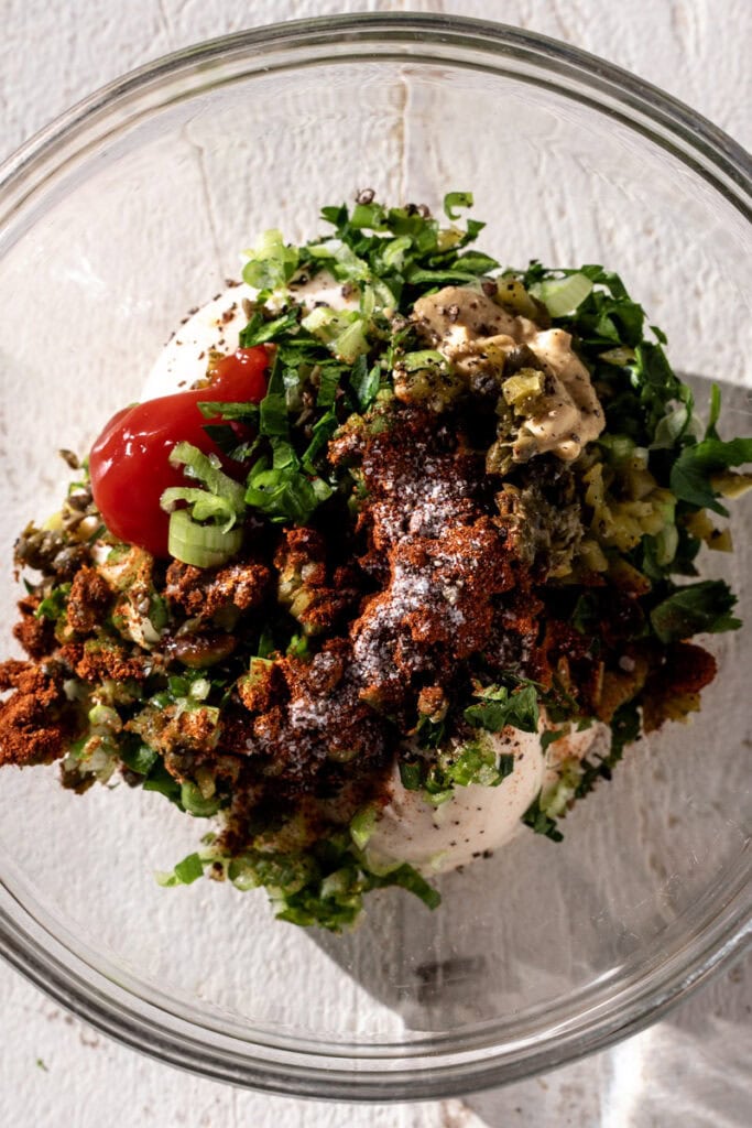 ingredients to make cajun remoulade in mixing bowl.