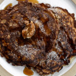 oatmeal griddle cakes with cinnamon butter and maple syrup.