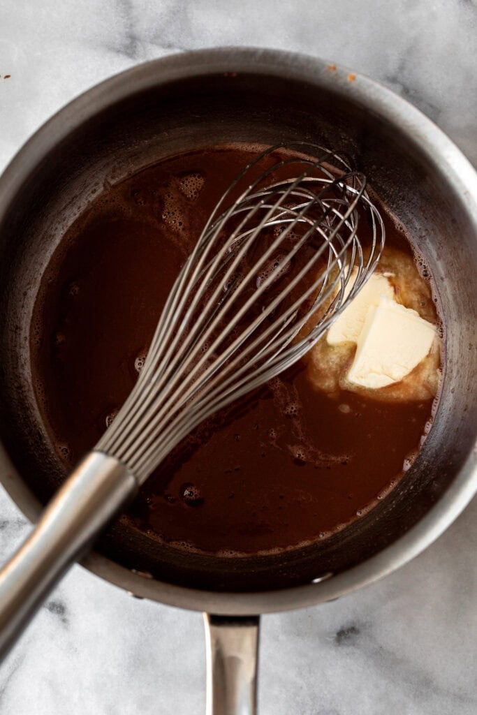 whisking in butter to red wine reduction.