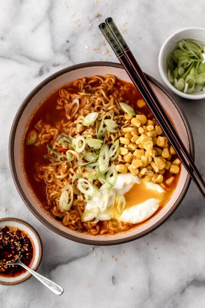 Cooked Store-Bought Instant Ramen with poached egg and corn.