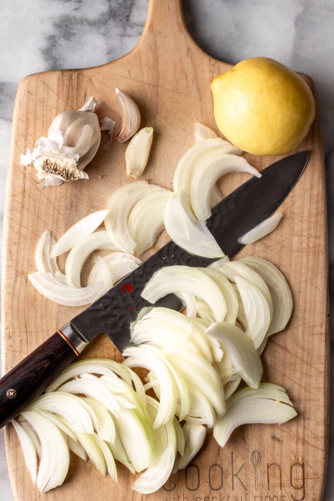 Creamy White Bean and Lemon Pasta ingredients sliced onion and garlic.