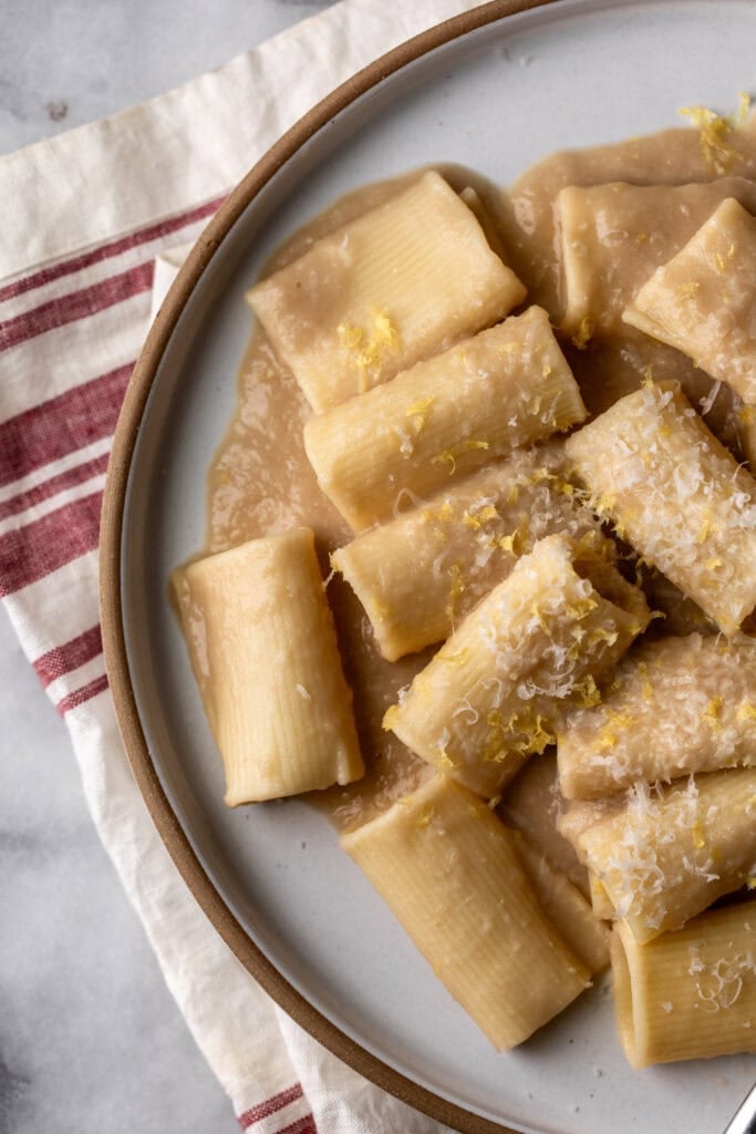 Simple creamy white bean and lemon pasta made with Paccheri noodles and lemon zest.