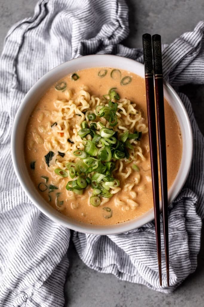 cheesy store-bought ramen with thinly sliced green onion.