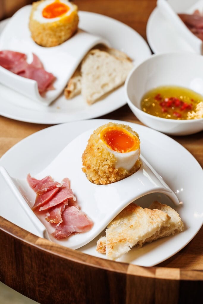 happy egg orange yolks with ham and spicy honey.