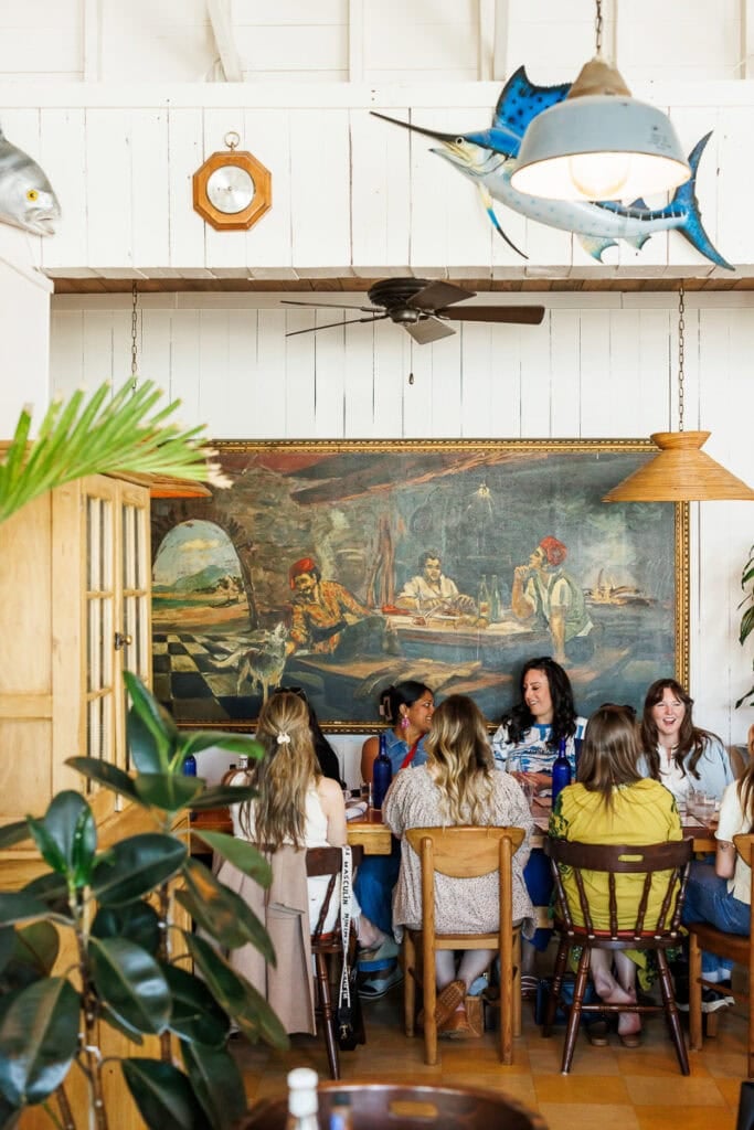 women sitting at seafood restaurant.