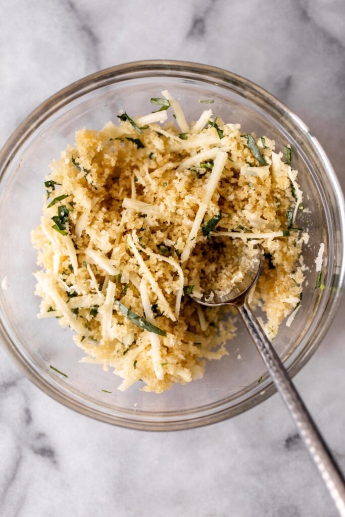 breadcrumb and gruyere cheese topping mixed in glass bowl.