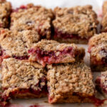 strawberry rhubarb crumble bars cut into squares.