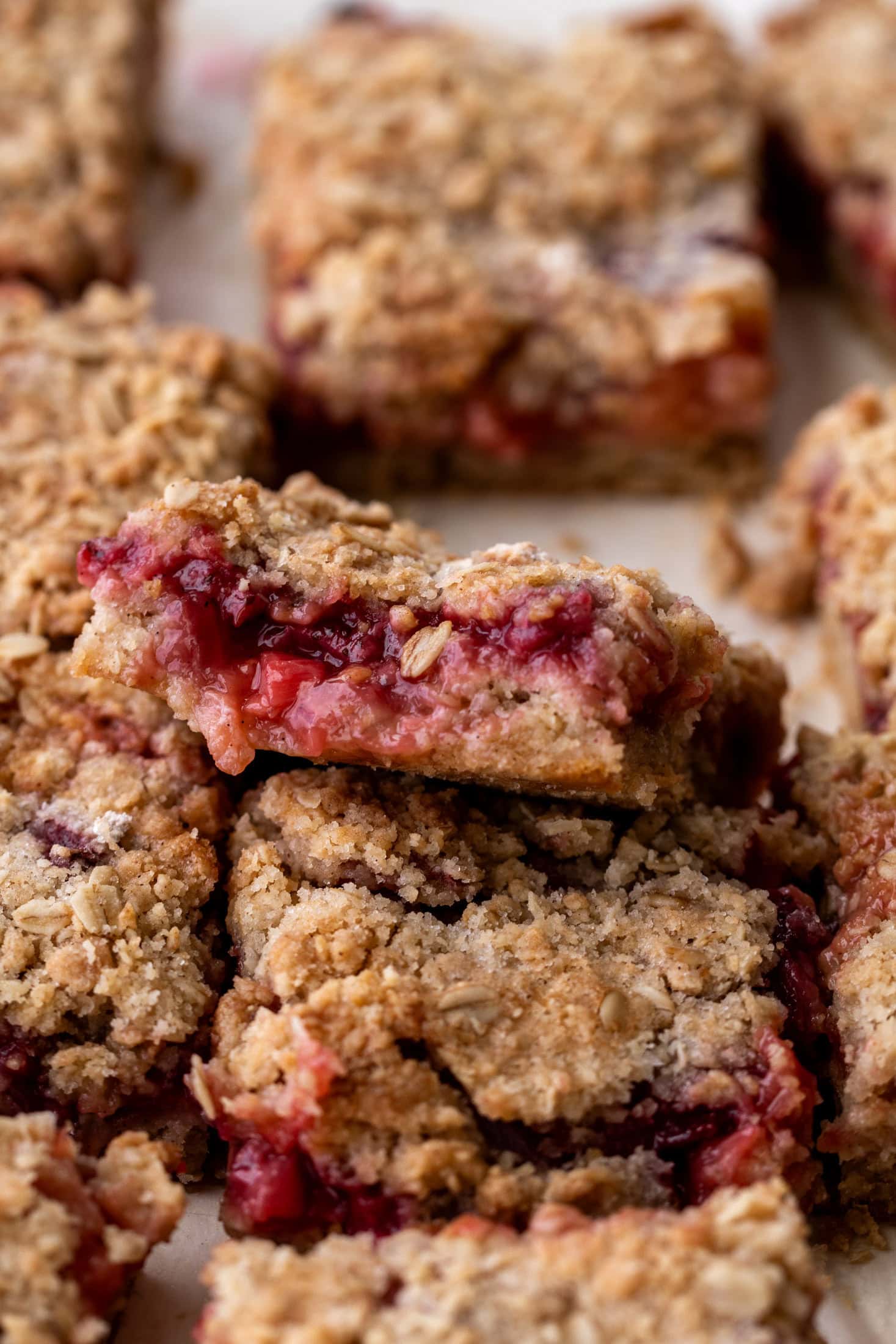 oat crumble bars with strawberry rhubarb fruit filling.