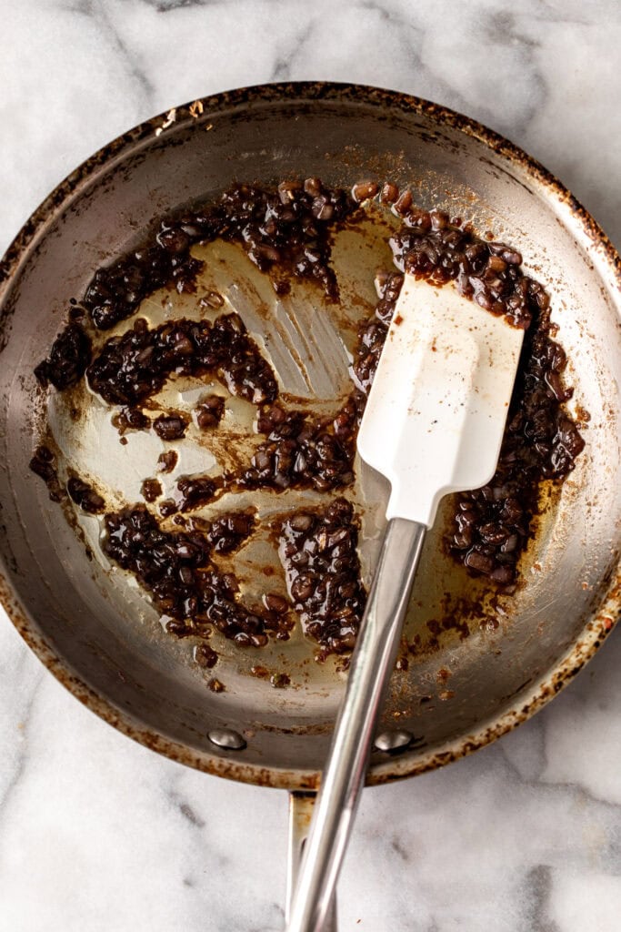 warm dressing with vinegar made in pan.
