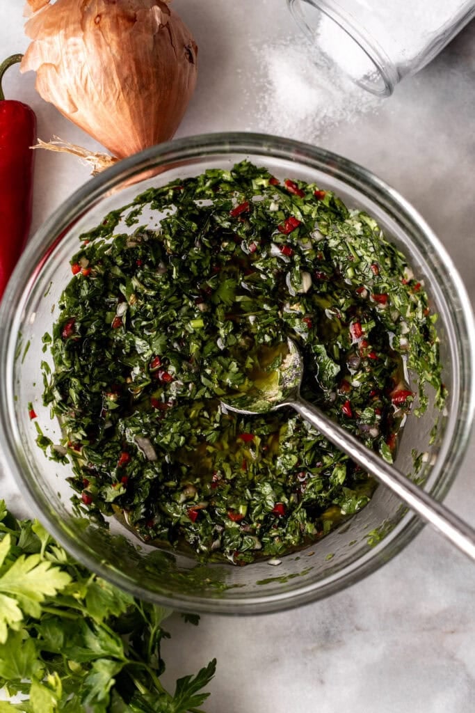 chimichurri mixture in glass bowl.