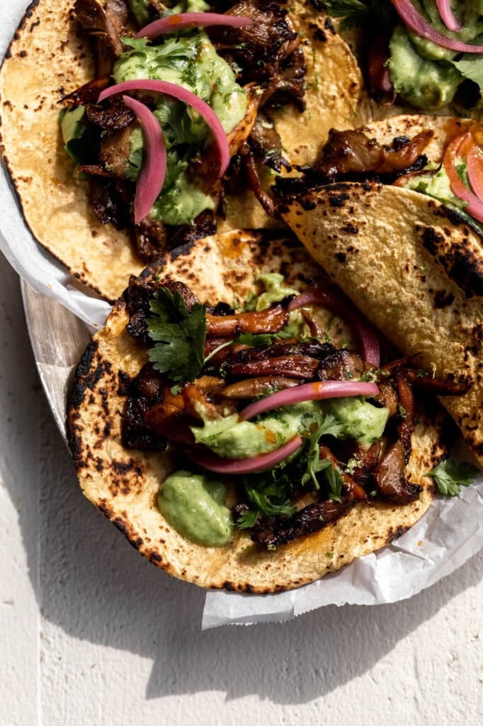 crispy adobo mushroom tacos with avocado-tomatillo salsa.