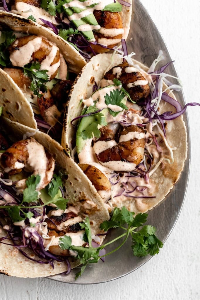 grilled honey lime shrimp tacos with purple shredded cabbage.