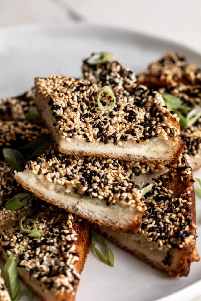 fried crispy shrimp toasts with sesame seeds.