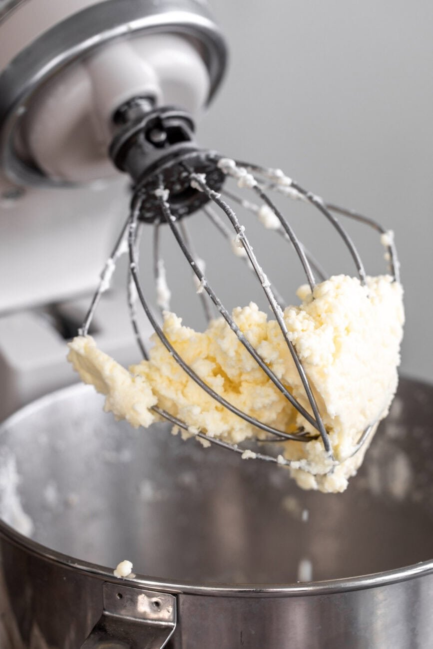 butter separated from buttermilk on whisk.