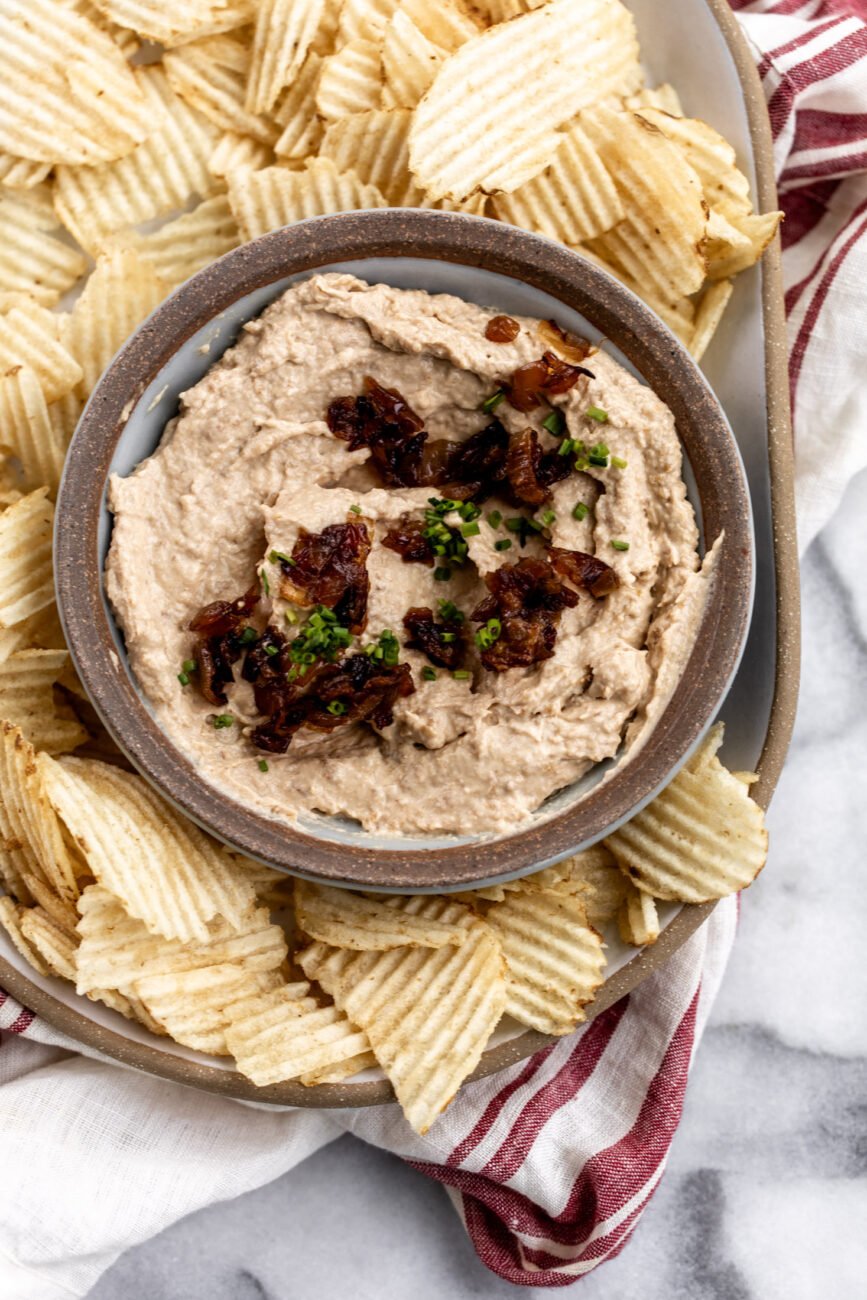 sweet onion dip with caramelized onions and potato chips.