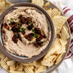 sweet onion dip with caramelized onions and potato chips.
