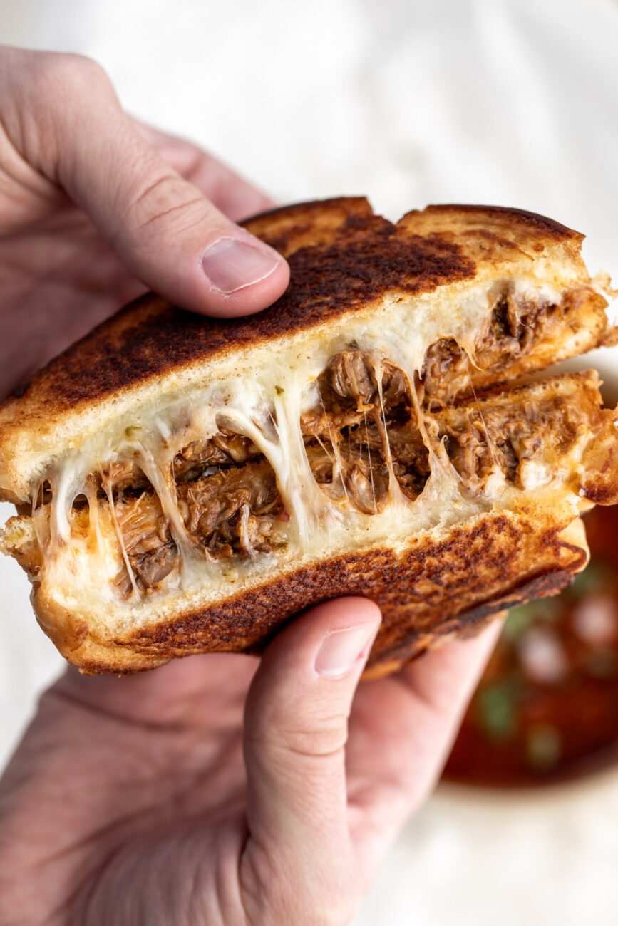 birria grilled cheese sandwich cheese pull.