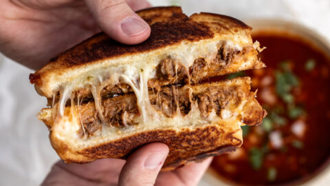 birria grilled cheese pulled open with consommé for dipping.