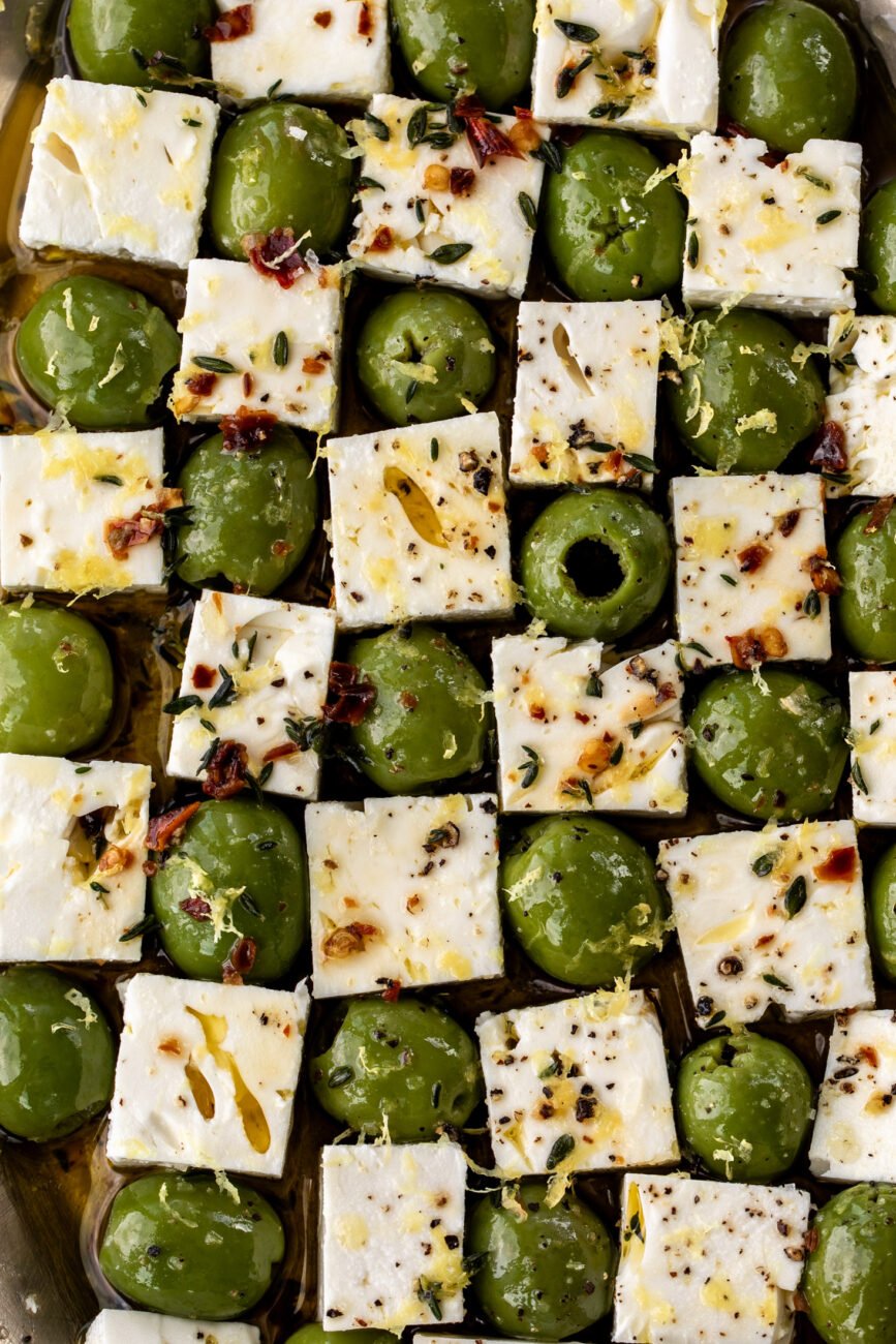Marinated olives and feta cheese in checkerboard pattern.