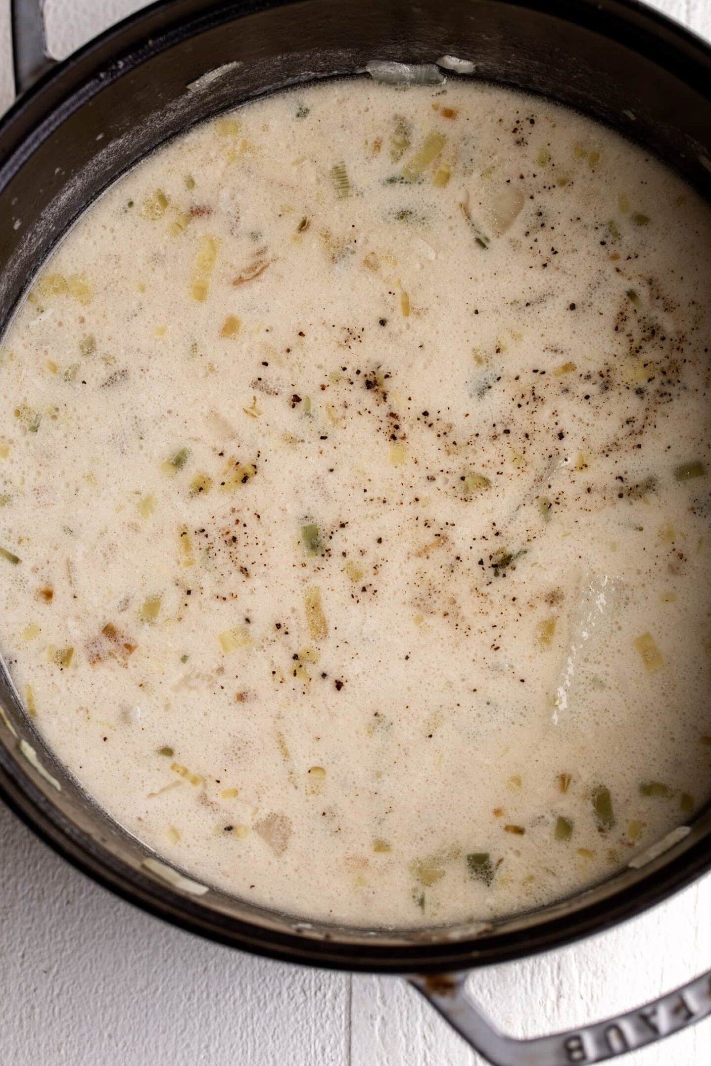 creamy baked potato soup in pot.