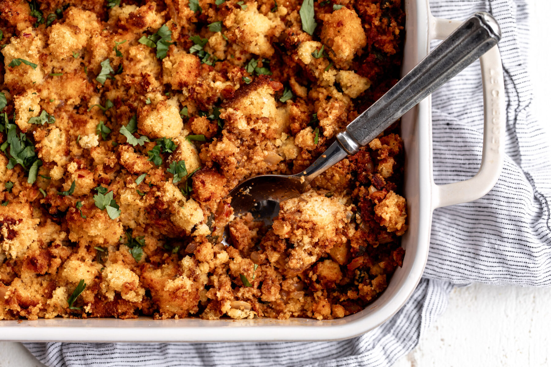 Chorizo cornbread stuffing in baking dish.