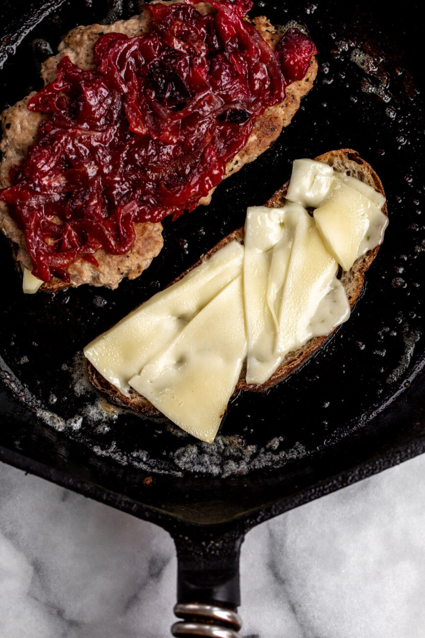 thanksgiving turkey patties on bread with cheese.