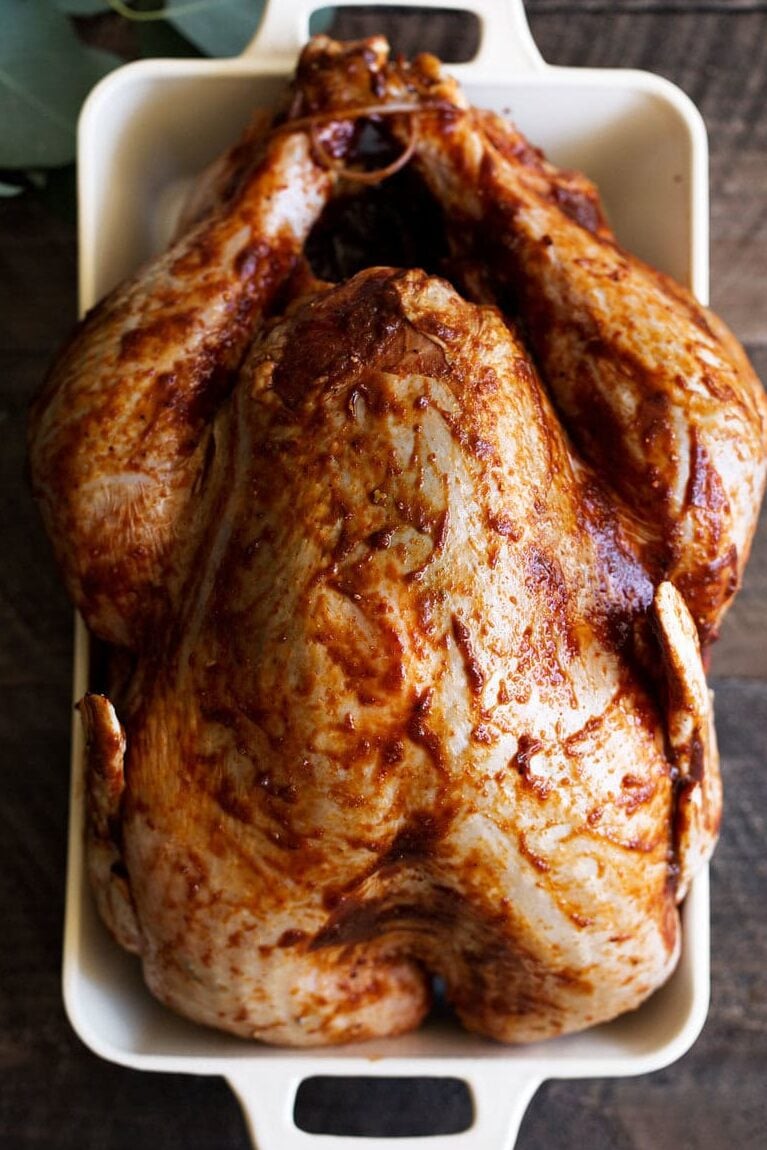 chili paste rubbed turkey in baking dish.